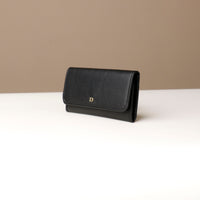 Black leather wallet on a neutral background