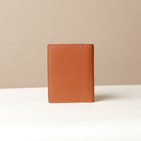 Back view of leather passport case Nirua on neutral background