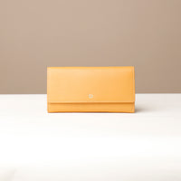 Front view of yellow VersaViva Clutch premium leather wallet and mobile holder by Danilo’s
