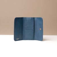 Blue wallet open to show interior compartments on a neutral background.