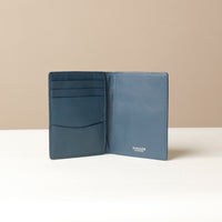 Blue Open Nirua passport holder showing interior compartments