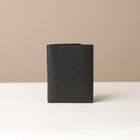 Black Leather passport case Nirua with card slots, front view