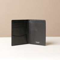 Black Open Nirua passport holder showing interior compartments