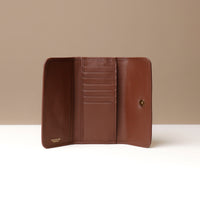 Brown leather wallet open against a neutral background