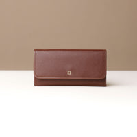 Three Elise Wallets in black, brown, and blue colors, displayed in an overlapped fashion on a light background.