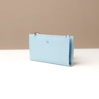 Light blue wallet on a neutral background