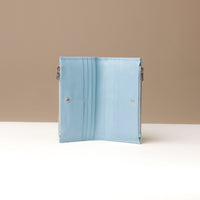 Light blue wallet open on a neutral background