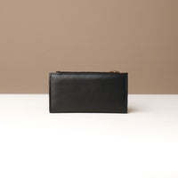 Black leather pouch on a neutral background