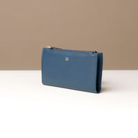 Blue leather wallet on a neutral background
