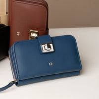 Blue wallet with a gold clasp on a light background
