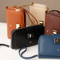 Collection of leather handbags in various colors on a light background
