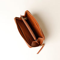 Brown leather wallet on a white background