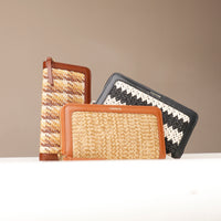 Three woven wallets with different patterns on a neutral background