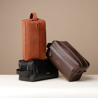 three-toiletry-bag-leather-tan-brown-black-with-visible-brand-danilos