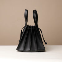 Back view of black Luxury leather bucket bag with multiple carry options