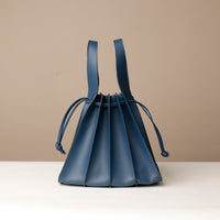 Back view of blue Luxury leather bucket bag with multiple carry options