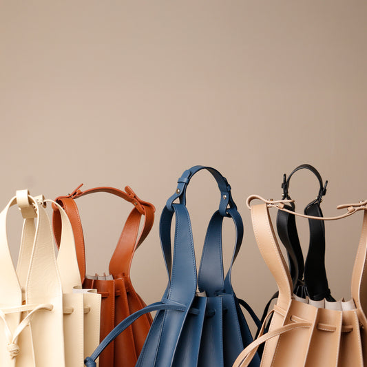 Papillon Bag pleated leather bucket bag by Danilo’s featuring the strap