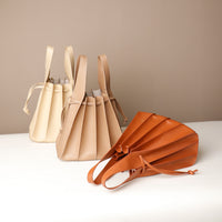 Three Luxury leather bucket bag with multiple carry options