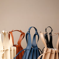 Papillon Bag pleated leather bucket bag by Danilo’s featuring the strap