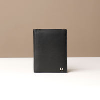 Black leather wallet on a neutral background