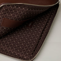 Open interior of brown Mathias Document Leather executive folder with multi-functional pockets