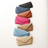 Lineup of colorful Stylish leather glasses case for men and women on a white background