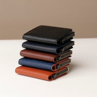 A stack of RFID blocking card case wallets in various colors including black, navy, brown, and tan.