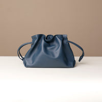 Iridescent navy pouch bag by Danilo’s – soft leather satchel with shoulder strap and metallic sheen

