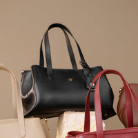 satchel-handbag-solene-bag-leather-black-set-on-a-rock