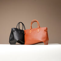Saule Tote Bag in black and cognac brown leather – large structured designer tote with top handles and crossbody strap by Danilo’s