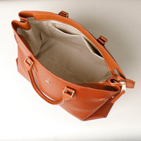 Interior of Saule brown leather tote – spacious microsuede-lined compartment with interior pockets