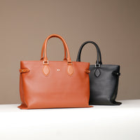 Black and brown Saule leather totes – side-by-side view of luxury structured handbags