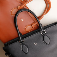 Top-down view of both Saule bags – large luxury totes with detachable straps and lined interiors