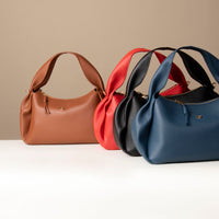 Collection of Aurora Soft Bags – pleated sculptural leather shoulder handbags in assorted hues
