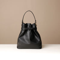 Back View of Black stylish leather handbag with a structured silhouette and versatile design, perfect for everyday wear and special occasions.