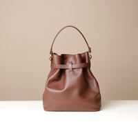 Back View of Maroon stylish leather handbag with a structured silhouette and versatile design, perfect for everyday wear and special occasions.