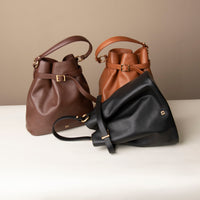 Three stylish leather handbag with a structured silhouette and versatile design, perfect for everyday wear and special occasions.