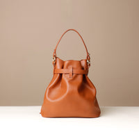 Back View of Brown stylish leather handbag with a structured silhouette and versatile design, perfect for everyday wear and special occasions.
