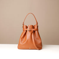 Brown stylish leather handbag with a structured silhouette and versatile design, perfect for everyday wear and special occasions.