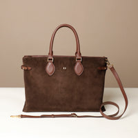 Brown suede leather danilos tote bag with a strap on a beige background