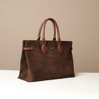 Brown suede leather danilos  tote bag with leather handles on a beige background
