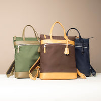 three-messenger-crossbodybag-ballistic-nylon-leather-green-brown-with-yellow-navy-details-transiktrek-front-view
