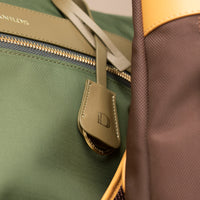 closeup-two-messenger-crossbodybag-ballistic-nylon-leather-details-transiktrek-green-brown-with-gold-hardware-with-visible-brand-danilos