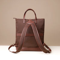 messenger-crossbodybag-ballistic-nylon-leather-details-transiktrek-brown-with-gold-hardware-back-view-straps