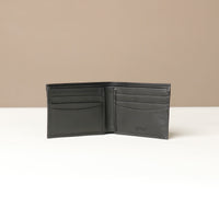 Front of a black nappa leather Milano wallet with eight visible slots