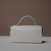 Back View of White Avela Bag with top handle and detachable strap