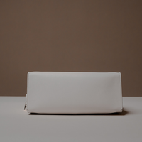 Bottom View of White Avela Bag with top handle and detachable strap