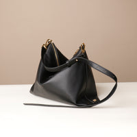 Zesté Crossbody Lux in black – convertible leather shoulder and top-handle bag with adjustable strap, handcrafted by Danilo’s