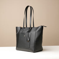 Side view of black Emma Pebble Leather Tote Bag by Danilos