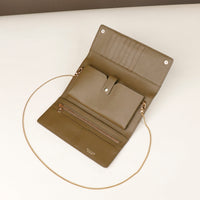 open danilos clutch versaviva in green leather with pouch for phone and card slots with gold zipper and chail
